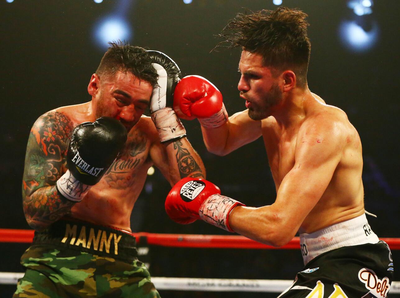 April 9, 2016; Las Vegas, NV, USA; Jose Ramirez moves in with a punch against Manny Perez at MGM Grand Garden Arena. Mandatory Credit: Mark J. Rebilas-USA TODAY Sports ** Usable by SD ONLY **