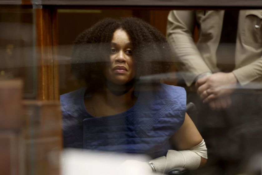 Nicole Linton appears in Los Angeles Superior Court for arraignment on murder charges stemming from a traffic accident, Monday, Aug. 8, 2022, in Los Angeles. Linton, suspected of causing a fiery crash that killed five people and an 8 1/2-month-old fetus near Los Angeles, has been charged with murder, as well as vehicular manslaughter, and is being held on $9 million bail. (Frederick M. Brown/Daily Mail.com via AP, Pool)