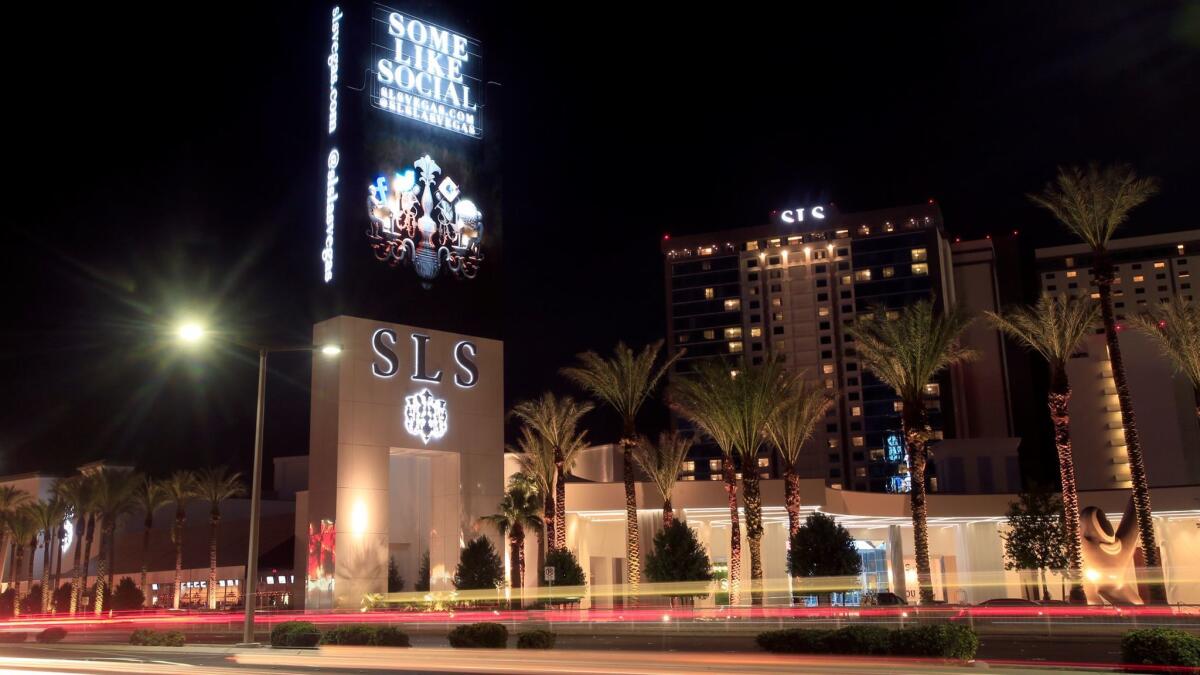 Traffic flows on Las Vegas Boulevard past the SLS hotel and casino in Las Vegas in 2014. Sixty Chinese investors in the project are suing, saying the project has not made a profit and they didn't get promised green cards in exchange for their investments.