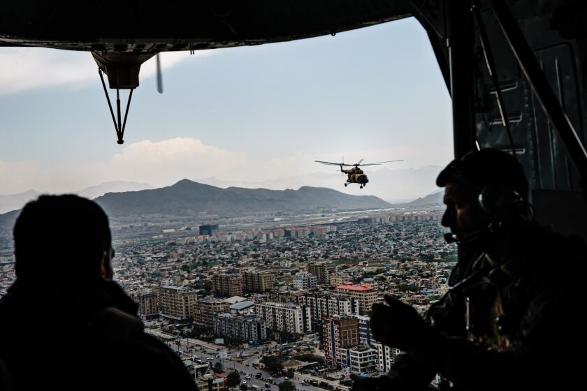 KABUL, AFGHANISTAN -- APRIL 28, 2021: Members of the 777 Special Mission Wing secure and transport the Chief of General Staff of the Armed Forces Gen. Mohammad Yasin Zia, to Camp Morehead, near Kabul, Afghanistan, Wednesday, April 28, 2021. (MARCUS YAM / LOS ANGELES TIMES)