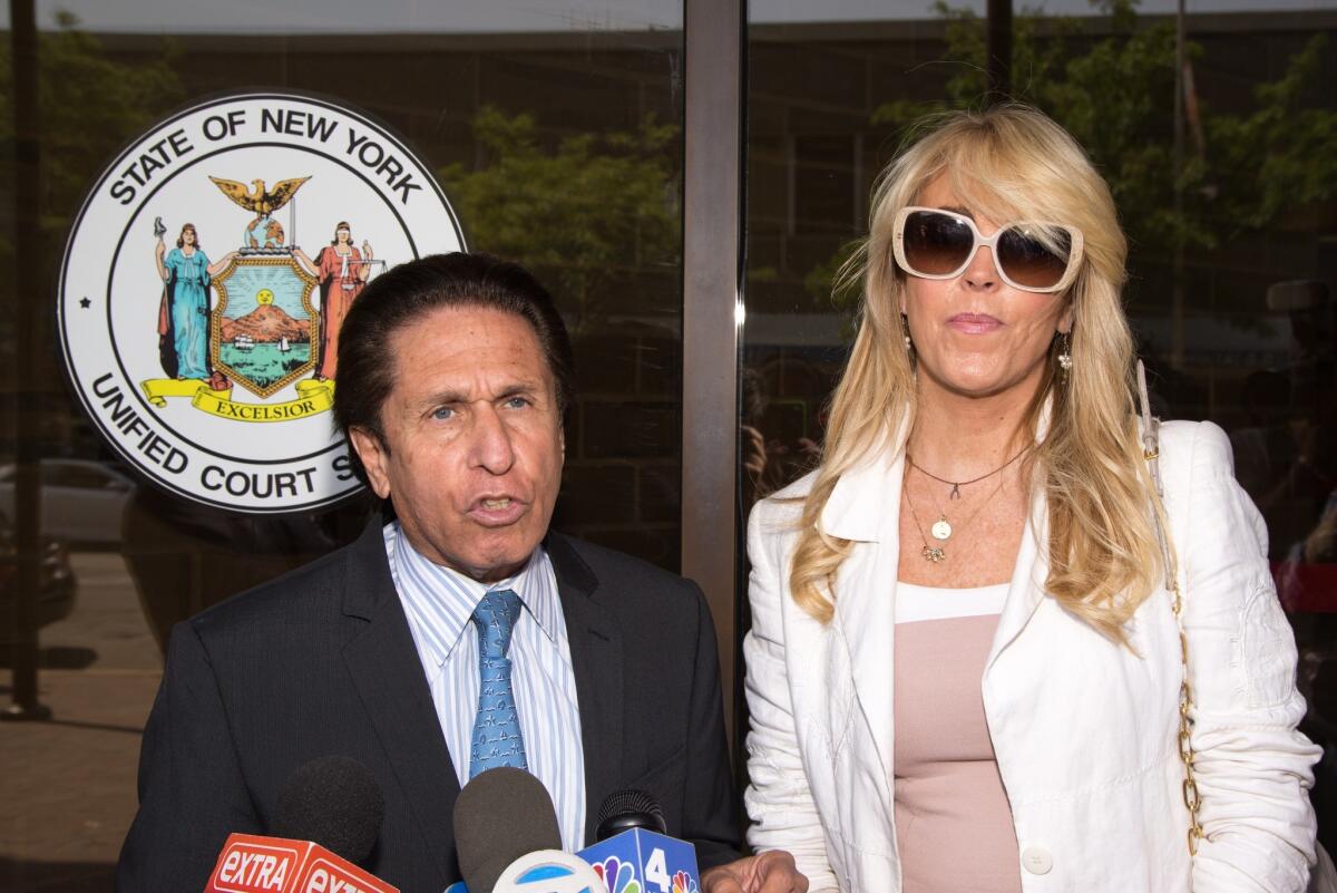Dina Lohan appears in court with her attorney, Mark Heller, at Nassau County First District Court on Tuesday in Hempstead, N.Y.
