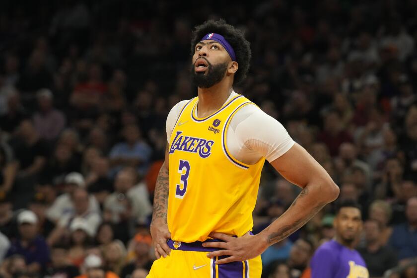 Los Angeles Lakers forward Anthony Davis (3) during the first half of an NBA basketball game against the Phoenix Suns, Tuesday, April 5, 2022, in Phoenix. (AP Photo/Rick Scuteri)