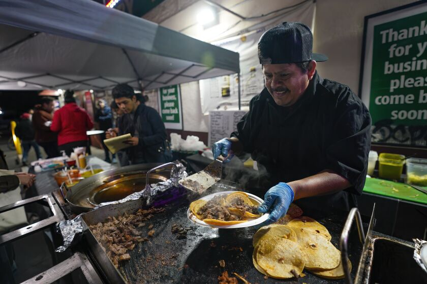 San Diego, CA - February 02: Setup in a parking lot of liquor store on Thursday, Feb. 2, 2023 in San Diego, CA., Teodoro Jimenez with help of his kids run their taco stand 7-days a week. (Nelvin C. Cepeda / The San Diego Union-Tribune)