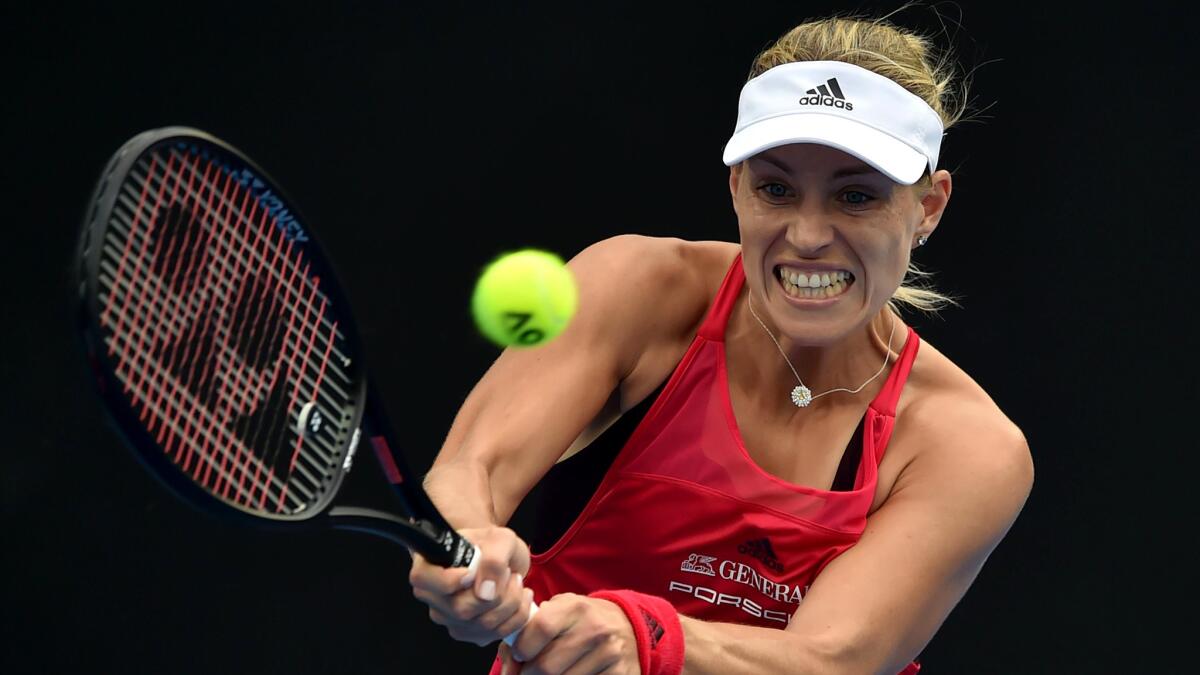 Angelique Kerber returns a shot against Ashley Barty during the women's final of the Sydney International on Saturday.