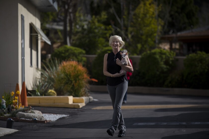 Tina Smith of Sunland takes a walk in her neighborhood with her dog.