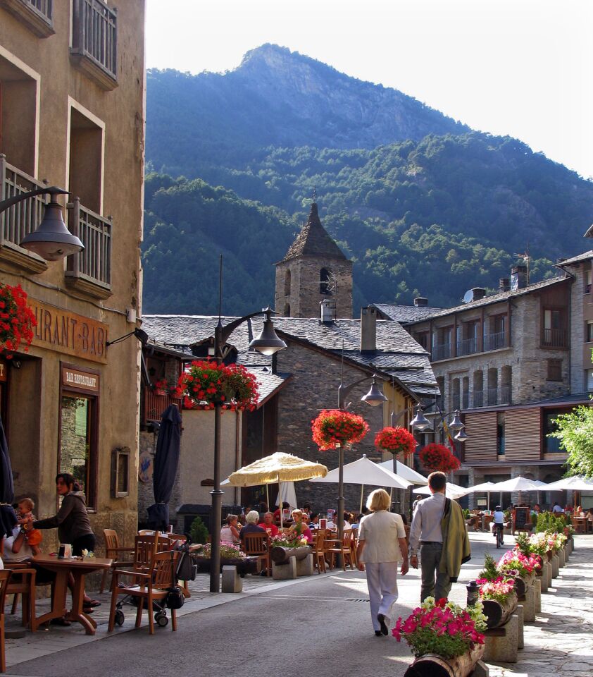 Andorra lines a high pass in the Pyrenees between France and Spain. I drove in from the north, stalled at a customs booth on the French border, where officials were opening trunks to inspect the loads of purchases leaving Andorra, a tax-free shopping mecca. -- Susan Spano