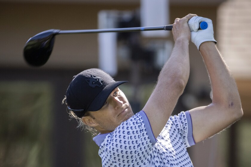 Morgan Hoffmann watches his drive off the third tee during the second round of the RBC Heritage golf tournament, Friday, April 15, 2022, in Hilton Head Island, S.C. (AP Photo/Stephen B. Morton)