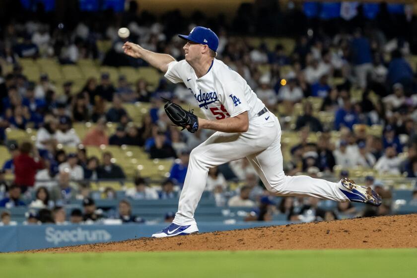 LOS ANGELES, CA - JULY 3, 2023: Los Angeles Dodgers relief pitcher Evan Phillips (59) pitches against the Pirates in the ninth inning to get the save in the Dodgers 5-2 win at Dodger Stadium on July 3, 2023 in Los Angeles, California. (Gina Ferazzi / Los Angeles Times)