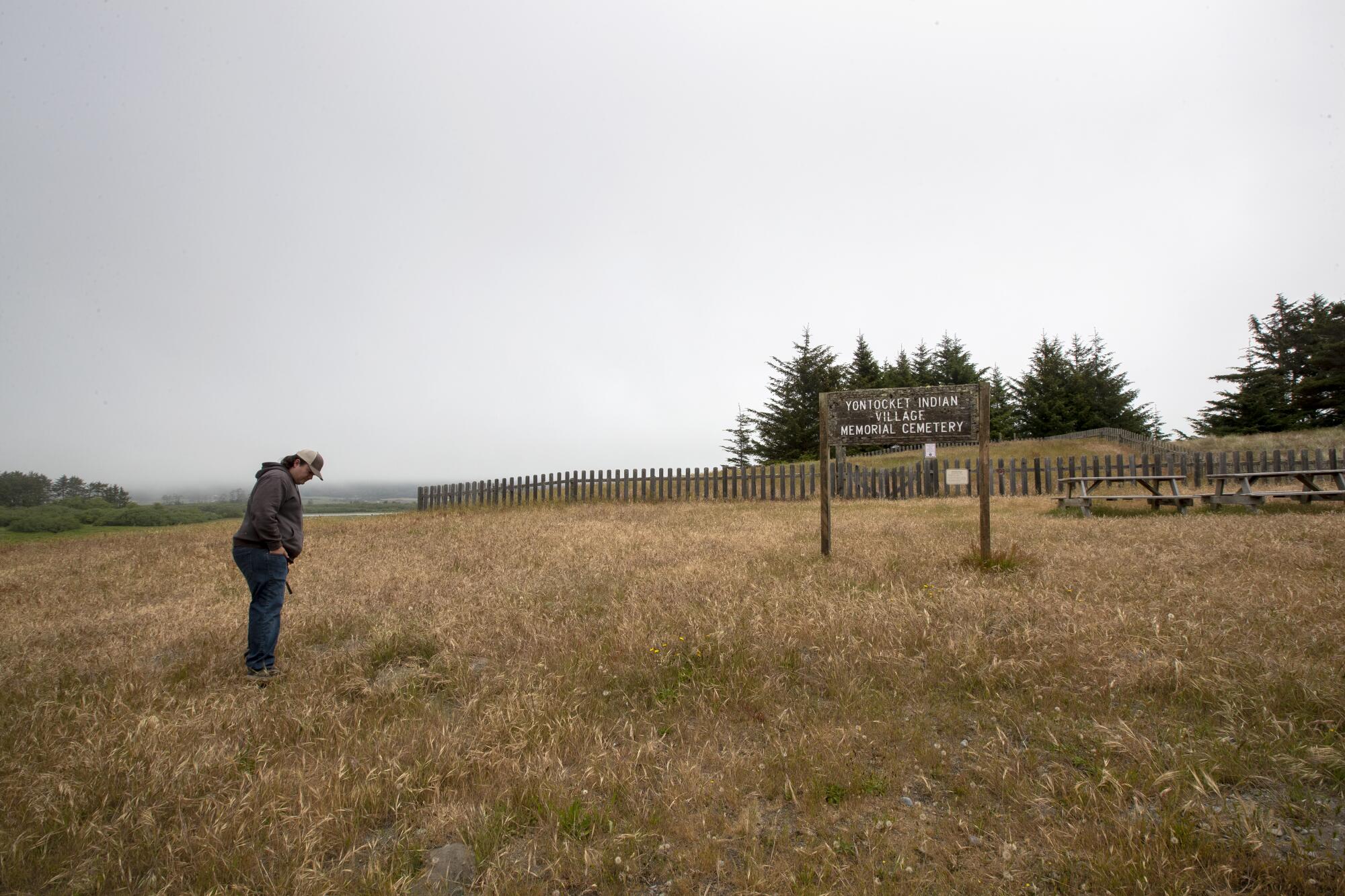 Scott Sullivan, vice chairperson of the Tolowa Dee-ni' Nation, visits a memorial of the 1853 massacre at Yontocket.