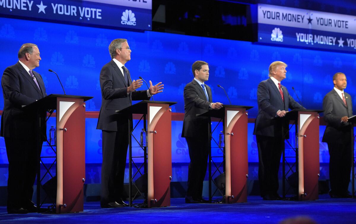 Jeb Bush, second from left, is flanked by Mike Huckabee, left, Marco Rubio, center, Donald Trump, second from right, and Ben Carson during the CNBC Republican presidential debate at the University of Colorado, Wednesday, Oct. 28, 2015, in Boulder, Colo.