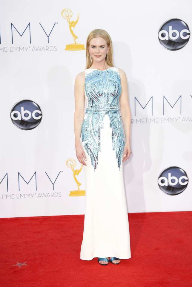 Nicole Kidman exemplified the less-is-more style philosophy in a sleek white column dress with scale-like sequin detail by Antonio Berardi.