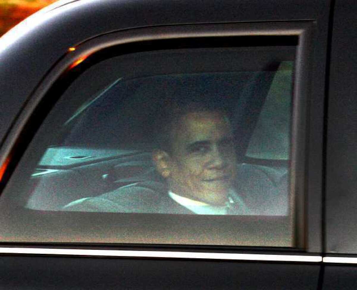 President Barack Obama looks out the window of the limousine in a motorcade leaving the Bob Hope Airport in Burbank on Wednesday. President Obama was heading to NBC studios for "The Tonight Show with Jay Leno."