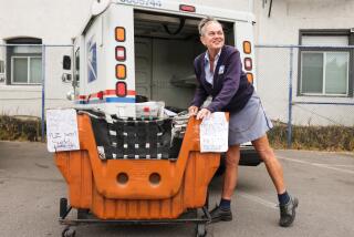 LONG BEACH-CA-JUNE 4, 2024: Mail carrier Mimi Ritz prepares for her route at the Long Beach Post Office during the United States Postal Service's Dog Bite Awareness campaign this week on June 4, 2024. Ritz suffered a dog bite last January. (Christina House / Los Angeles Times)