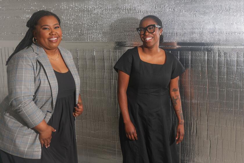 Los Angeles, CA – March 27: ChargerHelp co-founders Evette Ellis, left, and Kameale Terry, right, pose for a portrait at their headquarters on Wednesday, March 27, 2024 in Los Angeles, CA.  ChargerHelp, in part, trains people so they can get jobs maintaining and repairing electric vehicle chargers.  (Michael Blackshire / Los Angeles Times)