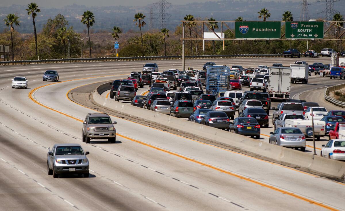 Traffic is backed up along the 210 Freeway in Irwindale after an accident earlier last month. Gov. Jerry Brown acted Saturday on a trio of bills that affect who can use the carpool lanes and when.