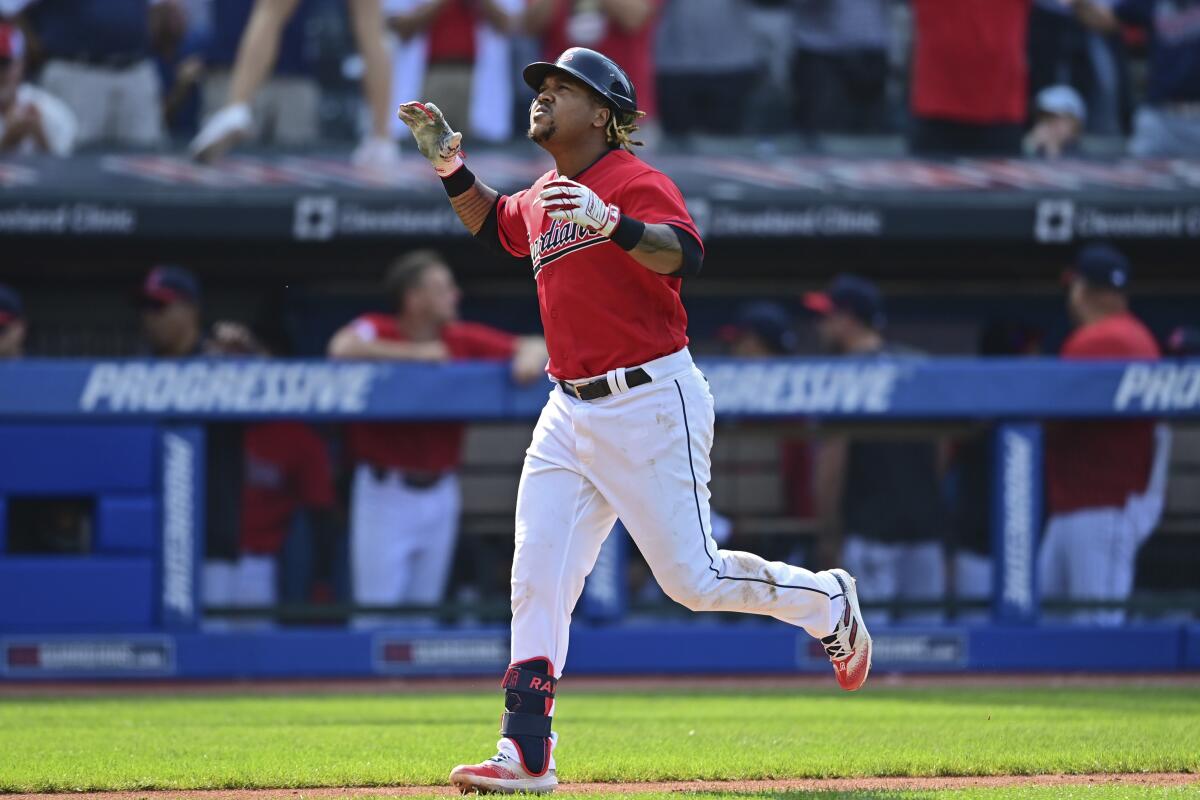 Cleveland Guardians third baseman Jose Ramirez celebrates while running the bases after hitting a two-run home run off Los Angeles Angels relief pitcher Ryan Tepera during the eighth inning of a baseball game, Wednesday, Sept. 14, 2022, in Cleveland. The Guardians won 5-3. (AP Photo/David Dermer)