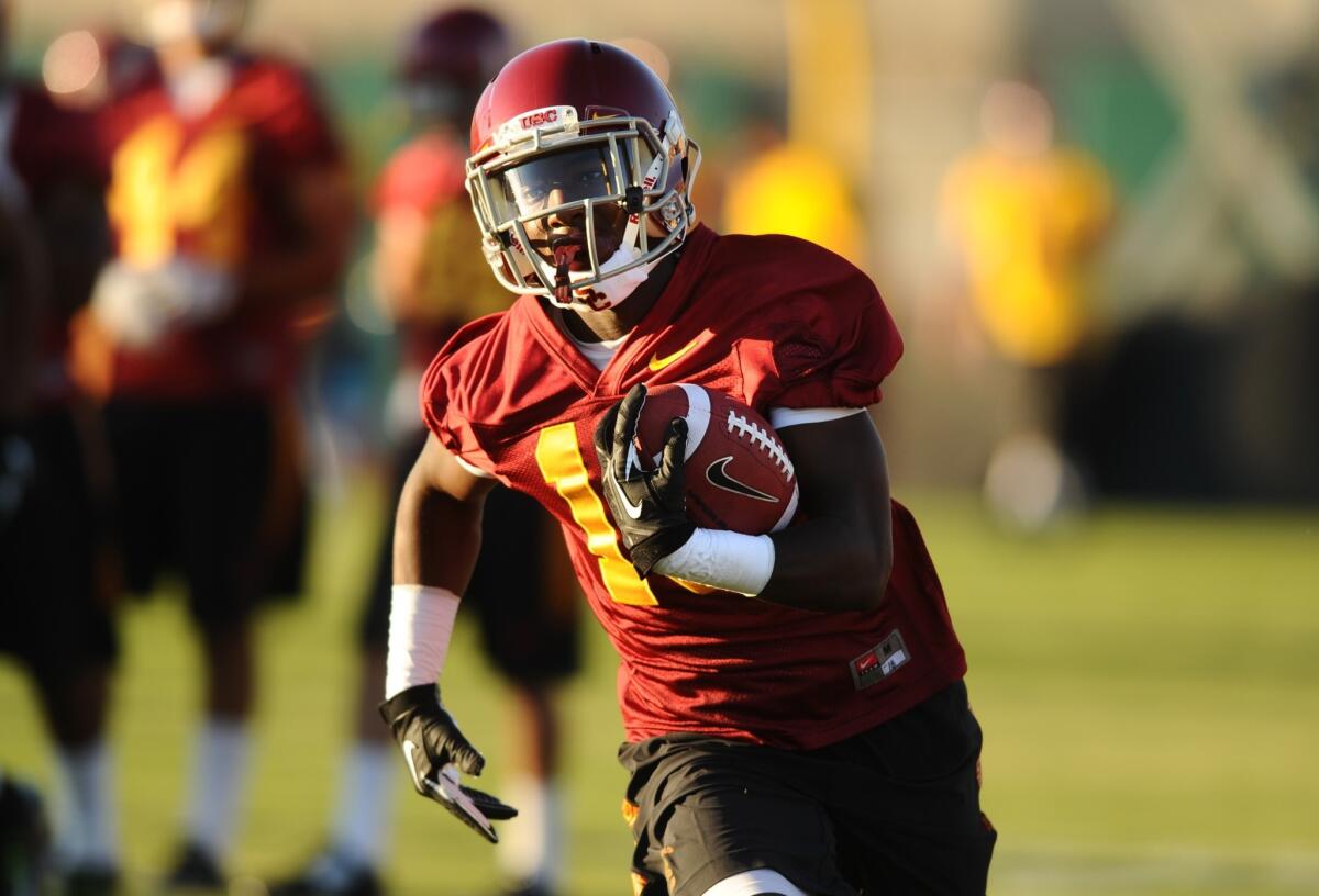 Former Crenshaw quarterback Ajene Harris has transitioned to the wide receiver position at USC so well he is now listed as a starter on the Trojans' depth chart.