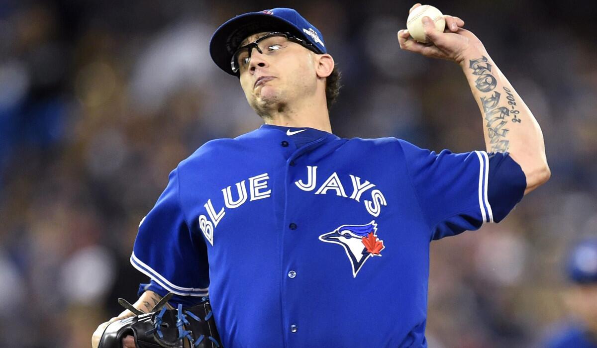 Toronto Blue Jays' closer Brett Cecil works against the Texas Rangers during the eighth inning in Game 2 of the American League Division Series on Friday.