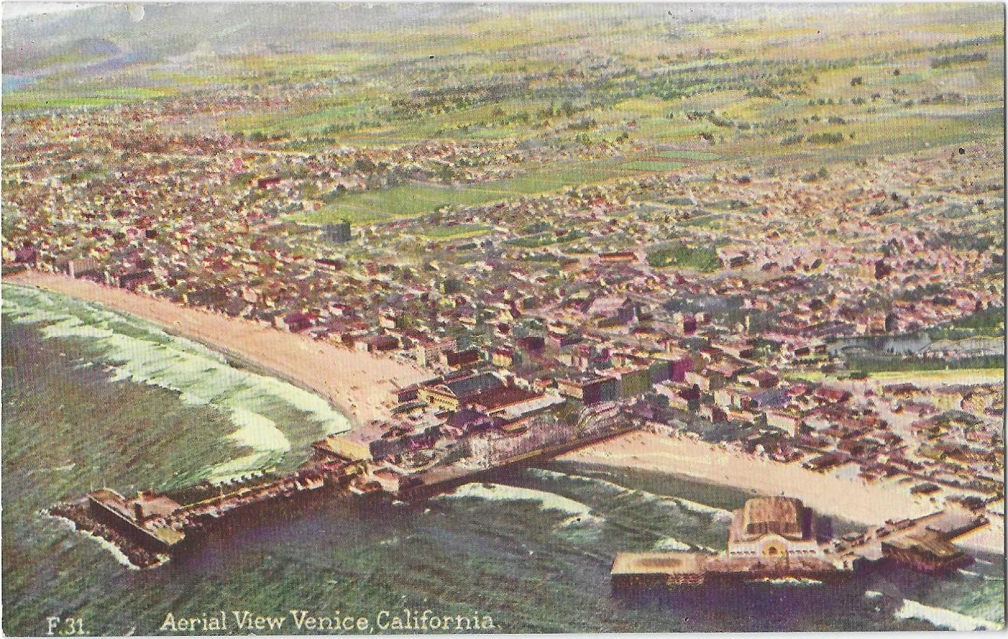 An old postcard shows two piers jutting into the surf and buildings on the shoreline