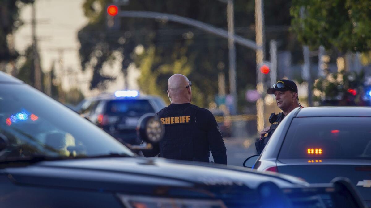 Sacramento County Sheriff's Department deputies near where an armed man fired on police Wednesday.