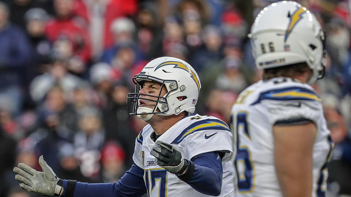 Chargers quarterback Philip Rivers expresses frustration during a second-half drive against the New England Patriots on Jan. 13, 2019.
