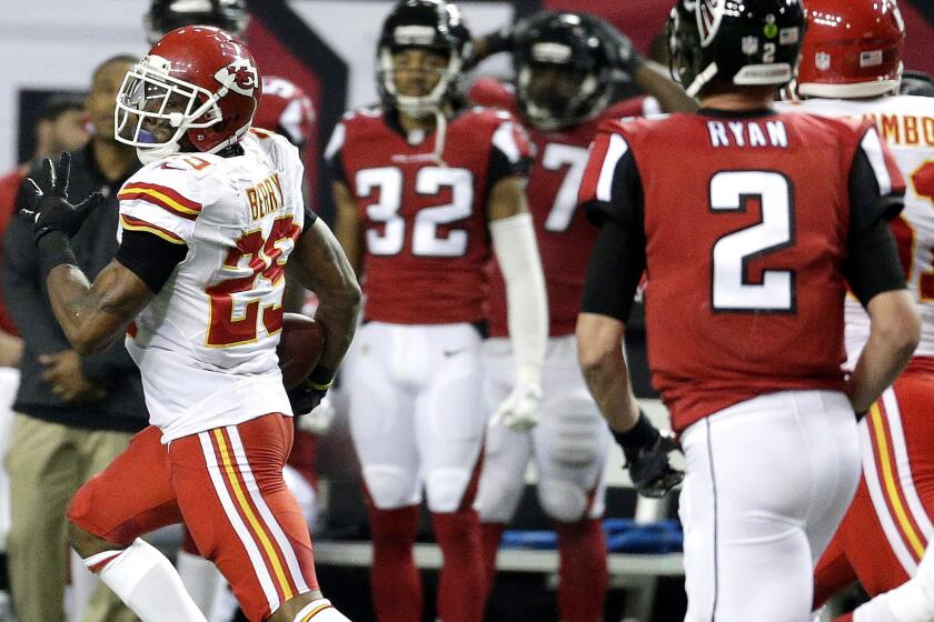 Chiefs safety Eric Berry (29) returns an interception for a score against the Falcons on Sunday.
