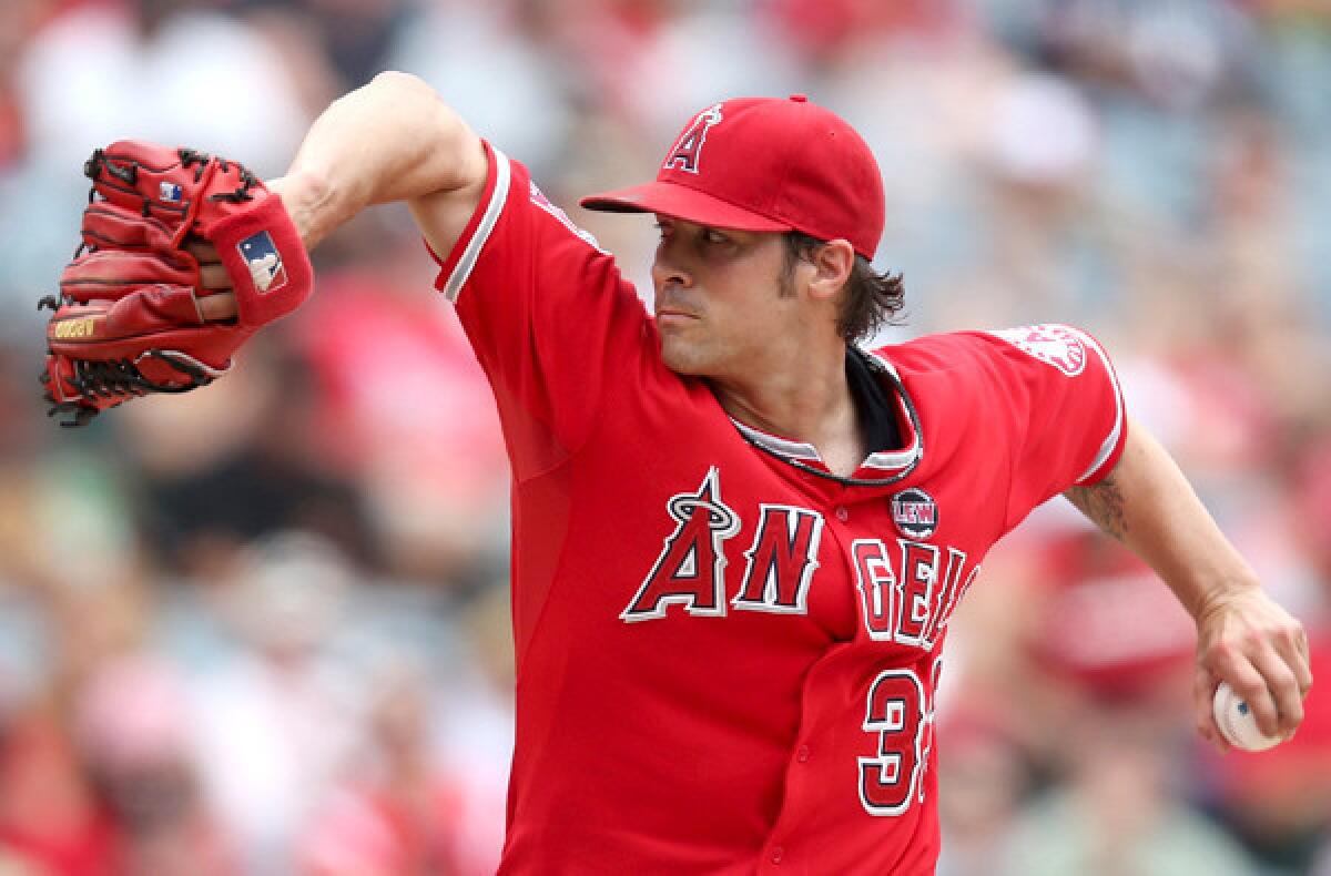 Angels starting pitcher C.J. Wilson held the Astros to three runs and six hits in 7 1/3 innings Sunday.
