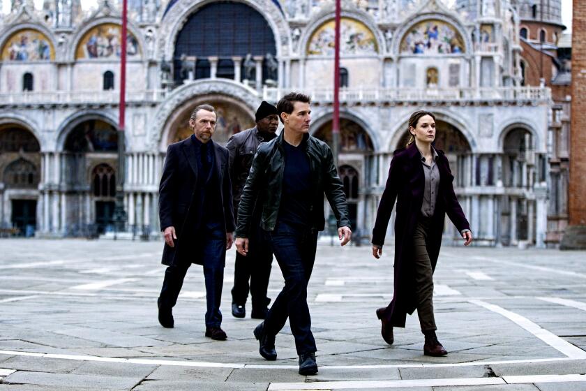 This image released by Paramount Pictures shows Simon Pegg, from left, Ving Rhames, Tom Cruise and Rebecca Ferguson in "Mission: Impossible Dead Reckoning - Part One." (Christian Black/Paramount Pictures and Skydance via AP)