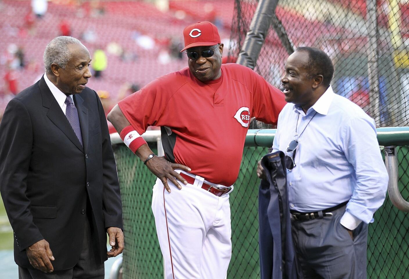 Frank Robinson, left, Cincinnati Reds manager Dusty Baker and Joe Morgan talk during batting practice before the start of Game 3 of the NLDS against the Philadelphia Phillies at Great American Ball Park on Oct. 10, 2010, in Cincinnati.