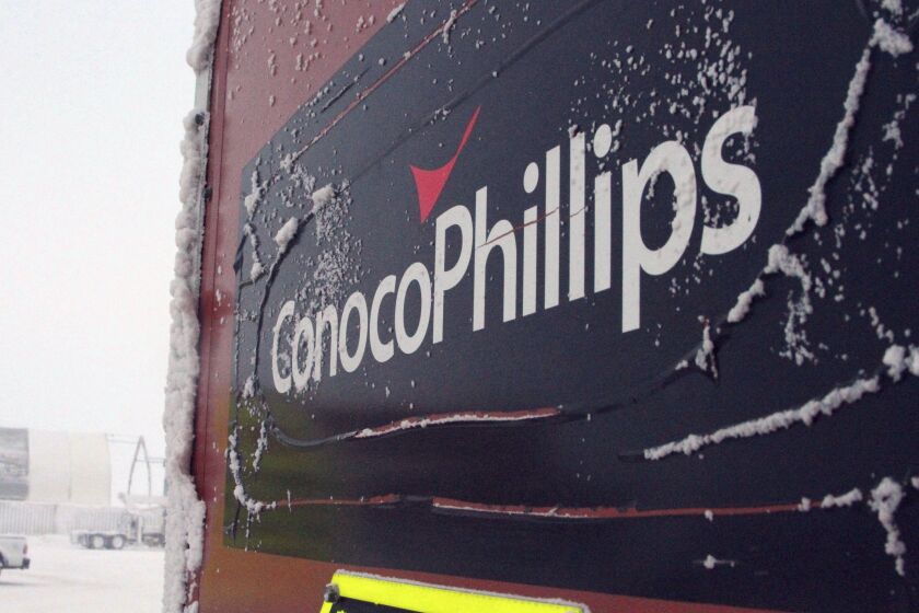 FILE - A ConocoPhillips sign covered in ice at the Colville-Delta 5, or as it's more commonly known, CD5, is seen at a drilling site on Alaska's North Slope on Feb. 9, 2016. ConocoPhillips has detailed reasons and remedies following a natural gas leak last year on the North Slope that caused 300 employees to be evacuated. Company officials spoke Thursday, March 23, 2023, during an Alaska Oil and Gas Conservation Commission hearing into the leak at its Alpine field. It said pumping 170 barrels of diesel fuel into a disposal well to prevent freezing caused a component to fail. The leak went unnoticed for days but was corrected. A company official says no one was harmed by the leak. (AP Photo/Mark Thiessen, File)