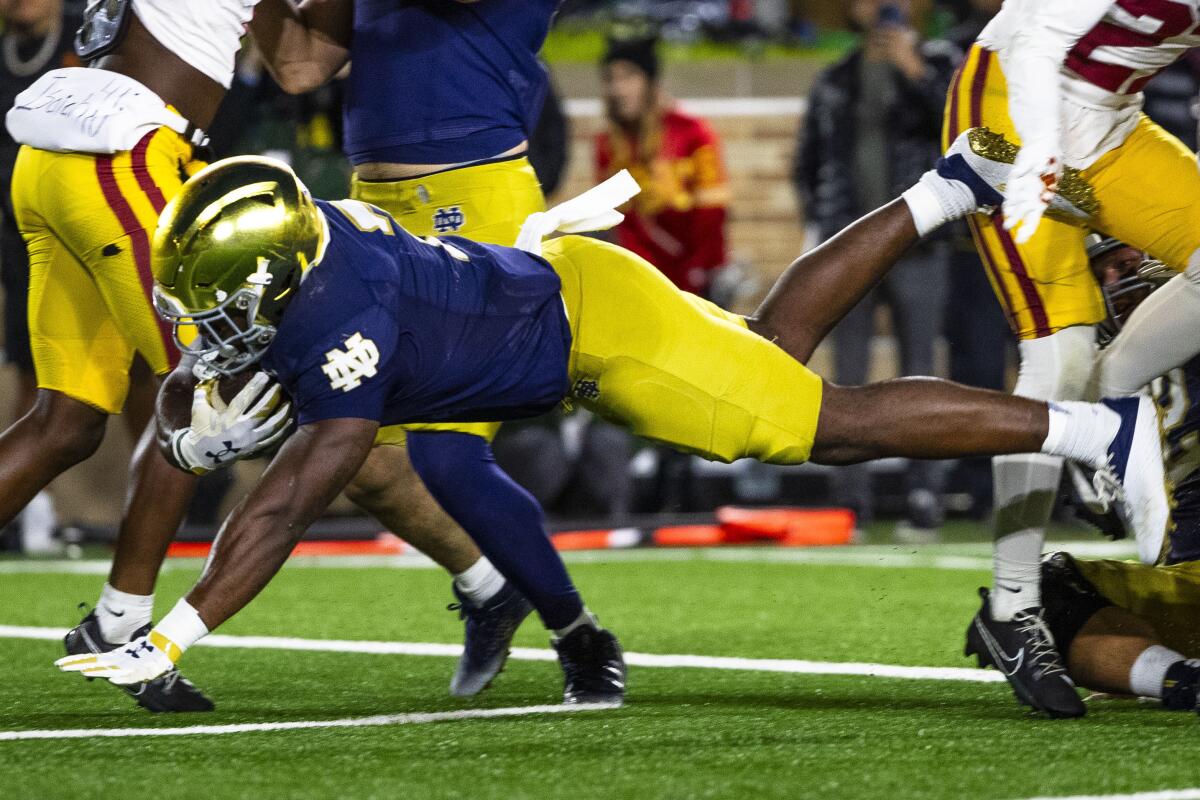 Notre Dame running back Audric Estime dives into the end zone