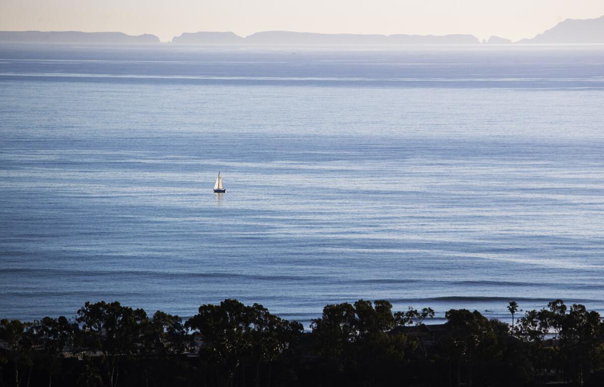 A lone sailboat is seen off Ventura on Jan. 21, 2021.