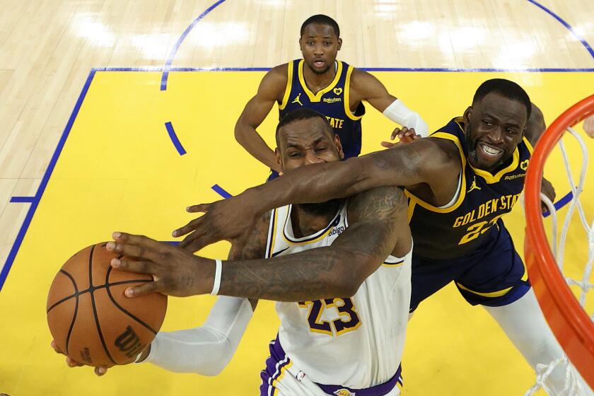 SAN FRANCISCO, CALIFORNIA - JANUARY 27: LeBron James #23 of the Los Angeles Lakers is fouled by Draymond Green #23 of the Golden State Warriors with one second left in double overtime at Chase Center on January 27, 2024 in San Francisco, California. James made both of the free throws and the Lakers won by one point. NOTE TO USER: User expressly acknowledges and agrees that, by downloading and or using this photograph, User is consenting to the terms and conditions of the Getty Images License Agreement. (Photo by Ezra Shaw/Getty Images)