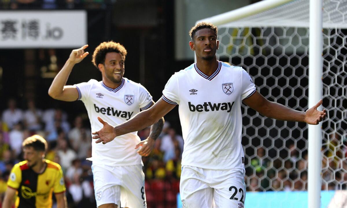 West Ham United's Sebastien Haller, right, celebrates scoring against Watford during the English Premier League soccer match at Vicarage Road, Watford, England, Saturday Aug. 24, 2019. (Aaron Chown/PA via AP)