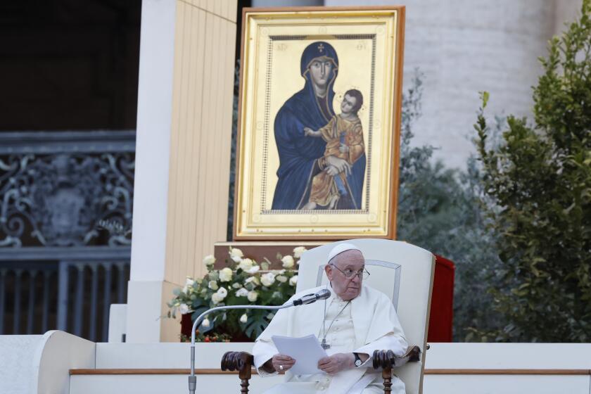 FILE - Pope Francis, sitting in front of a replica of the icon 'Maria Salus populi romani'', addresses the participants into "Together", a vigil prayer for the Synod of Bishops with church leaders in St. Peter's Square at The Vatican, Saturday, Sept. 30, 2023, three days ahead of the official opening of the XVI Assembly of the Synod of Bishops on 4 October. Pope Francis is convening a global gathering of bishops and laypeople to discuss the future of the Catholic Church, including some hot-button issues that have previously been considered off the table for discussion. Key agenda items include women's role in the church, welcoming LGBTQ+ Catholics and how bishops exercise authority. For the first time, women and laypeople can vote on specific proposals alongside bishops. (AP Photo/Riccardo De Luca, File)
