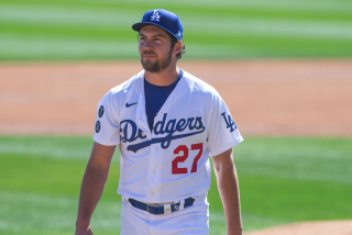 GLENDALE, AZ - MARCH 01: Trevor Bauer #27 of the Los Angeles Dodgers pitches during a spring training game.