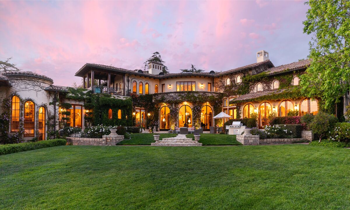 A mansion with a lawn.