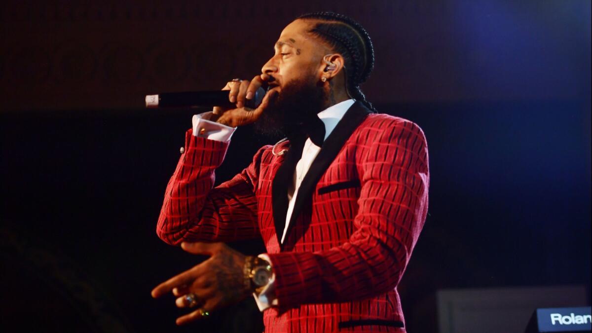 Nipsey Hussle performs onstage at the Warner Music Pre-Grammy Party at the NoMad Hotel on February 7 in Los Angeles. A memorial service for the Grammy-nominated rapper is set for 10 a.m. Thursday.