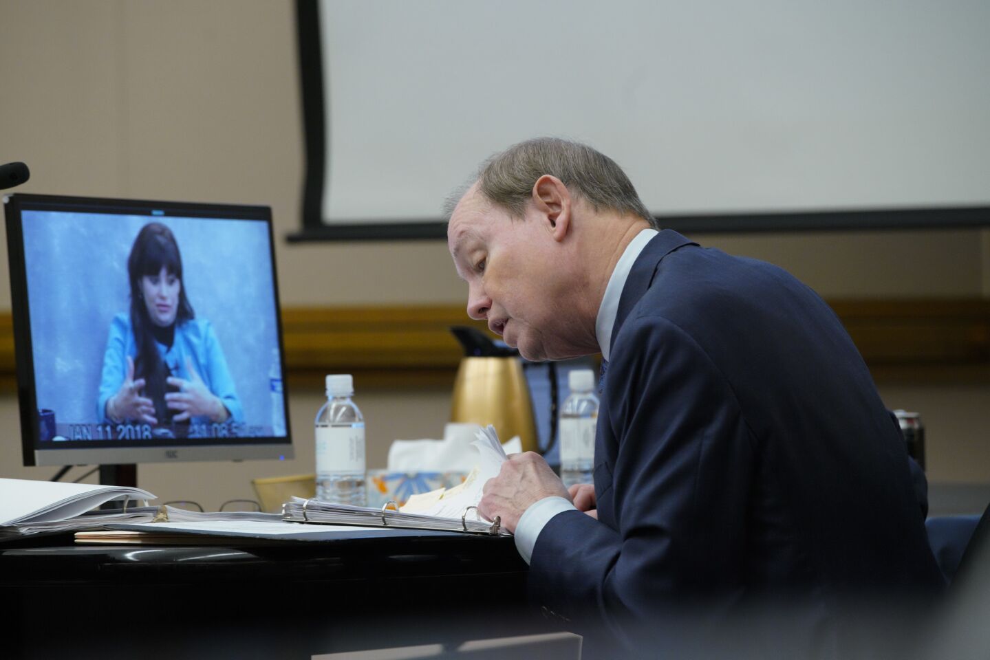 Dan Webb, defense attorney for Adam Shacknai reviews his notes during the video playback of Dina Shacknai's deposition taken on January 11, 2018.