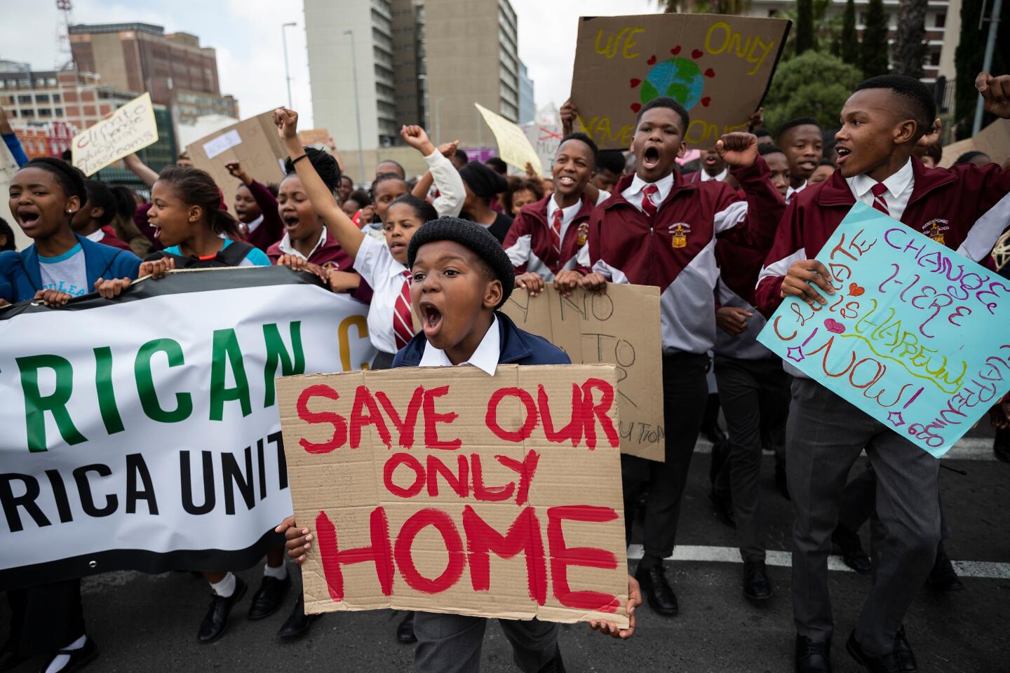 Mandatory Credit: Photo by NIC BOTHMA/EPA-EFE/REX (10419322d) Protesters take part in the Global Climate Strike as they march to parliament in Cape Town, South Africa, 20 September 2019. Thousands of children across South Africa joined the global call to action and climate strike protesting in Cape Town calling on government to make radical change in tackling climate change as millions of people around the world are taking part in protests demanding action on climate issues. Cape Town Global Climate Strike, South Africa - 20 Sep 2019 ** Usable by LA, CT and MoD ONLY **