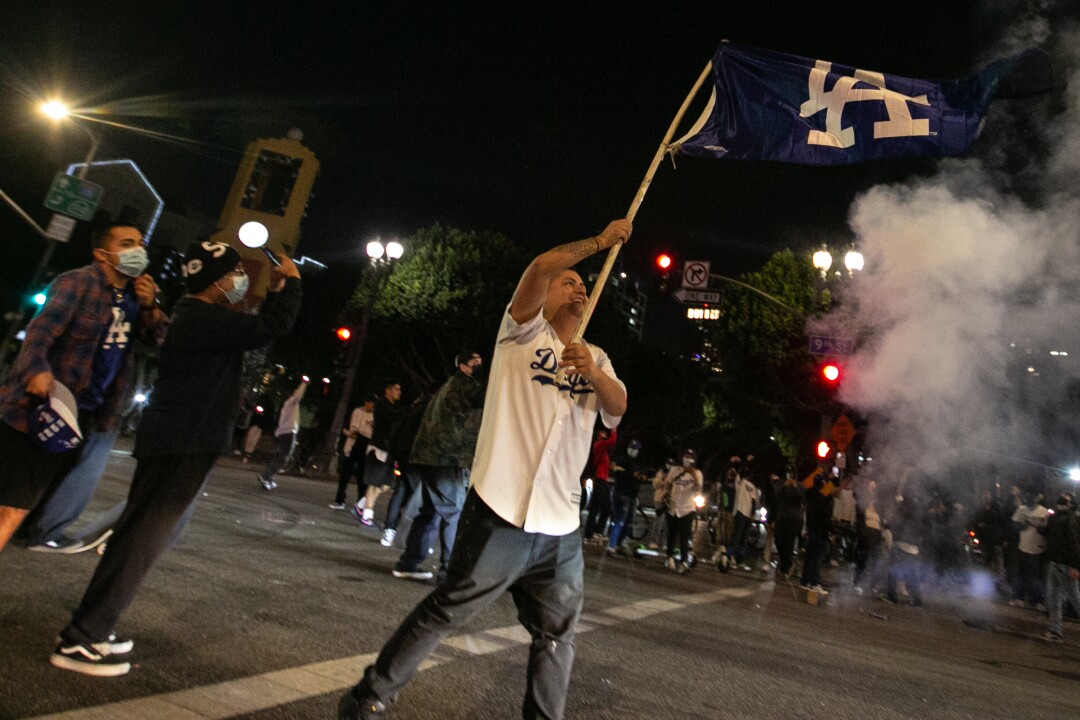 Fans celebrate in downtown Los Angeles after the Los Angeles Dodgers' victory in the World Series.