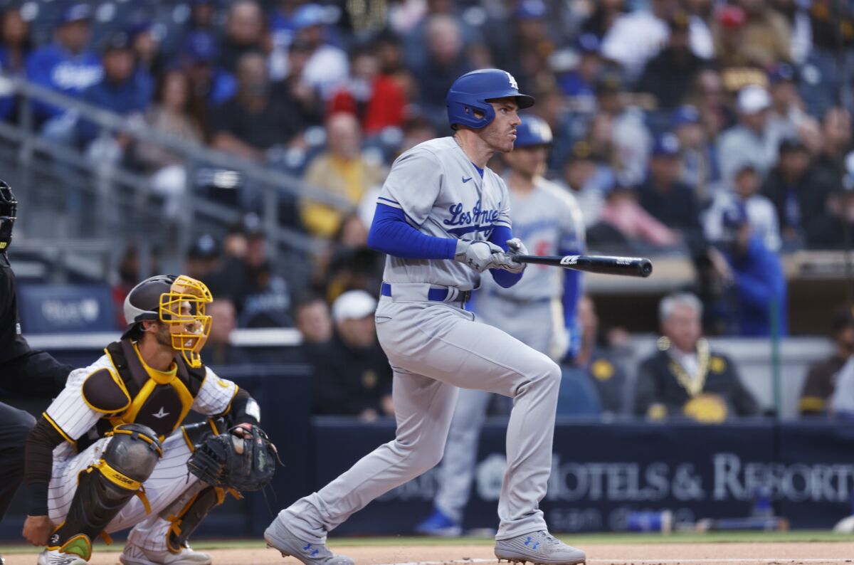 Dodgers first baseman Freddie Freeman singles against the Padres in the first inning Friday.