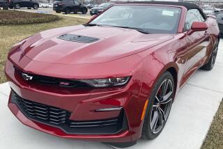 A 2023 Chevy Camaro 2SS Convertible is seen at a Chevy dealership in Wheeling, Ill., Wednesday, March 22, 2023. Strong sales in the U.S. helped General Motors increase its first-quarter net profit 19% over a year ago. (AP Photo/Nam Y. Huh)