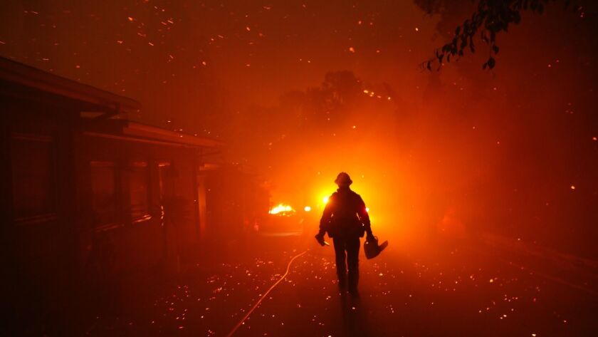 The Woolsey fire burns homes in Malibu last November. The blaze became the most destructive in L.A. and Ventura County's modern history.