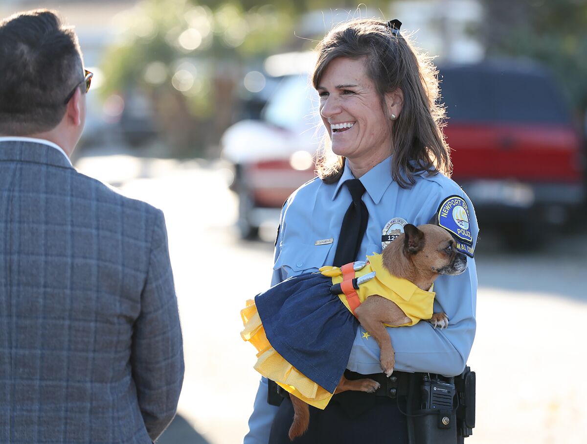 Animal Control Supervisor Valerie Schomberg laughs with guests at the Newport Beach Animal Shelter.