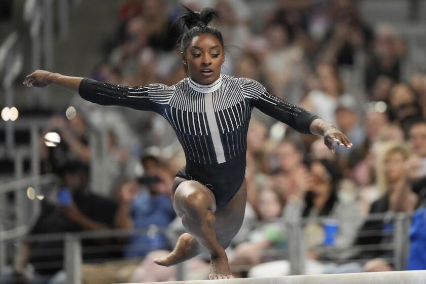 Simone Biles competes on the beam during the U.S. gymnastics championships.