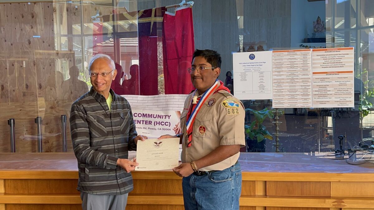 Anand Nair, a Life Scout in Poway's Troop 682, receives Presidential Volunteer Service Award from Dr. Prabhakar Tripuraneni.