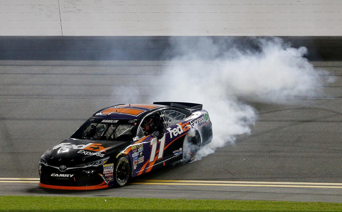 NASCAR driver Denny Hamlin celebrates after his victory in the Sprint Unlimited at Daytona International on Feb. 13.