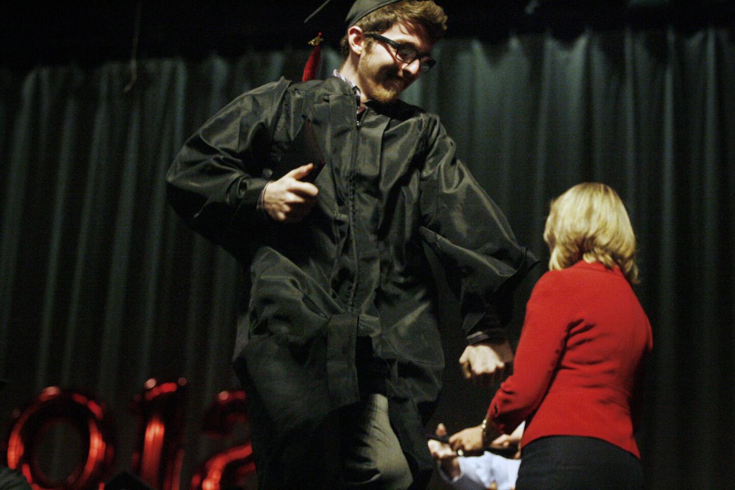 Monterey's George Tajerian, 18, dances onstage after receiving his high school diploma during his graduation ceremony, which took place at Luther Middle School in Burbank on Wednesday, June 6, 2012.