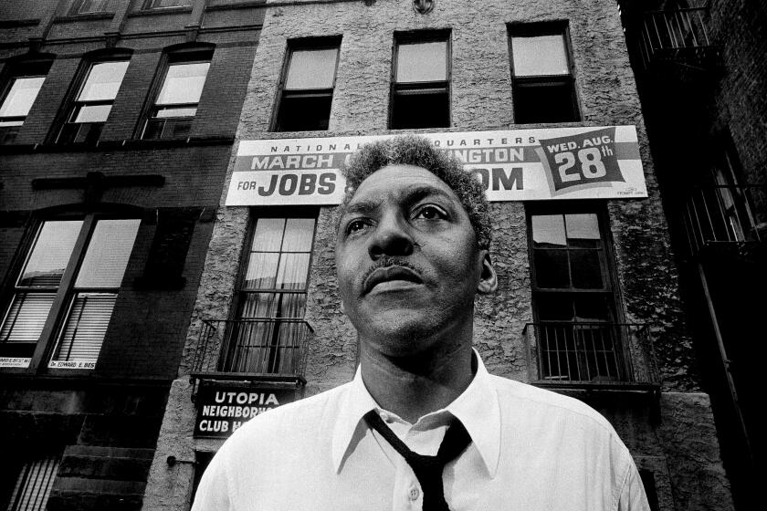 FILE - In this Aug. 1, 1963, file photo, Bayard Rustin, leader of the March on Washington poses in New York City. California's governor announced Wednesday, Feb. 5, 2020, that he is posthumously pardoning Rustin, a gay civil rights leader, while creating a new pardon process for others convicted under outdated laws punishing homosexual activity. (AP Photo/Eddie Adams, File)